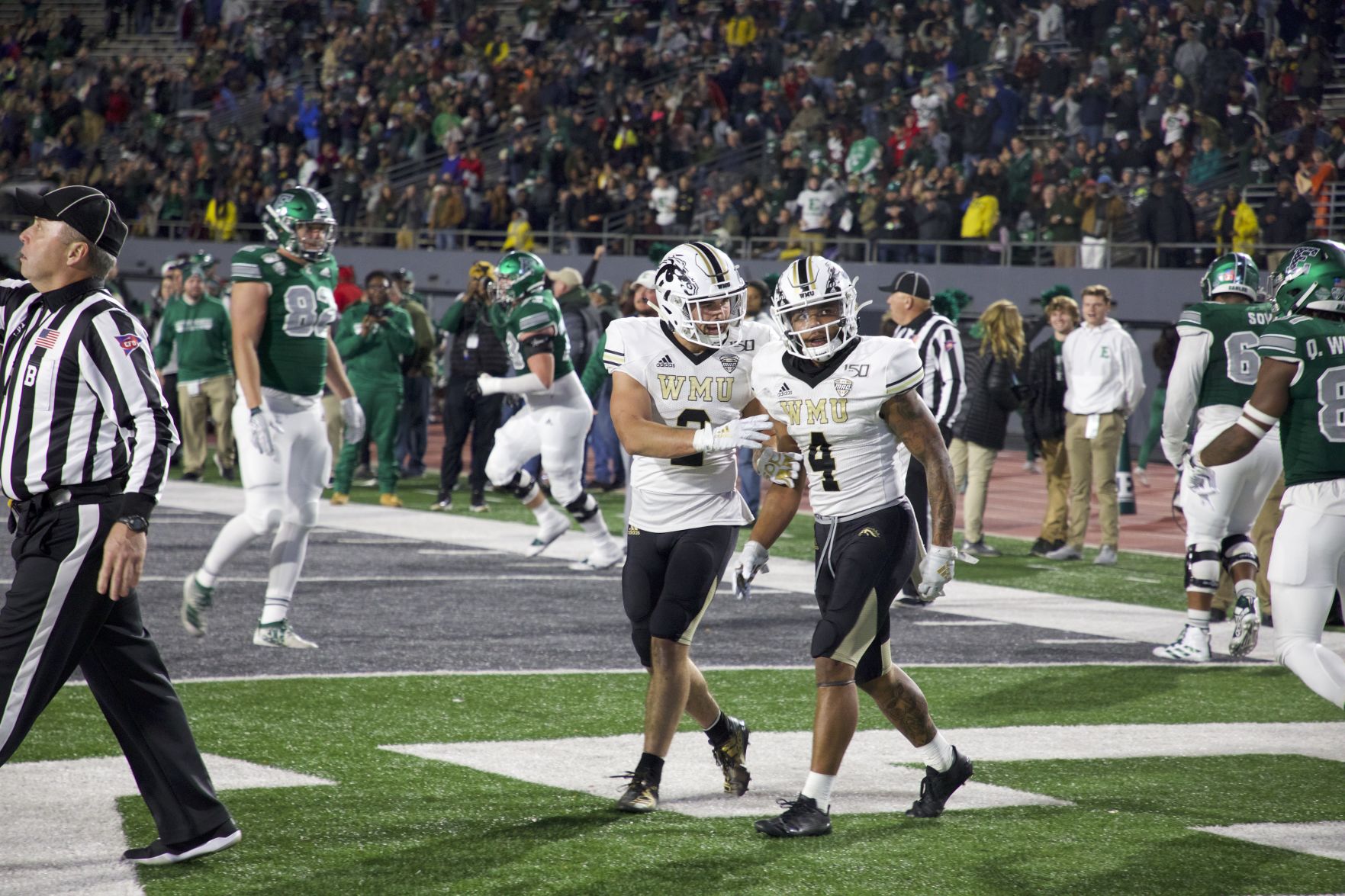 Senior safety Justin Tranquill consoles sophomore CB Patrick Lupro after giving up go-ahead touchdown pass.